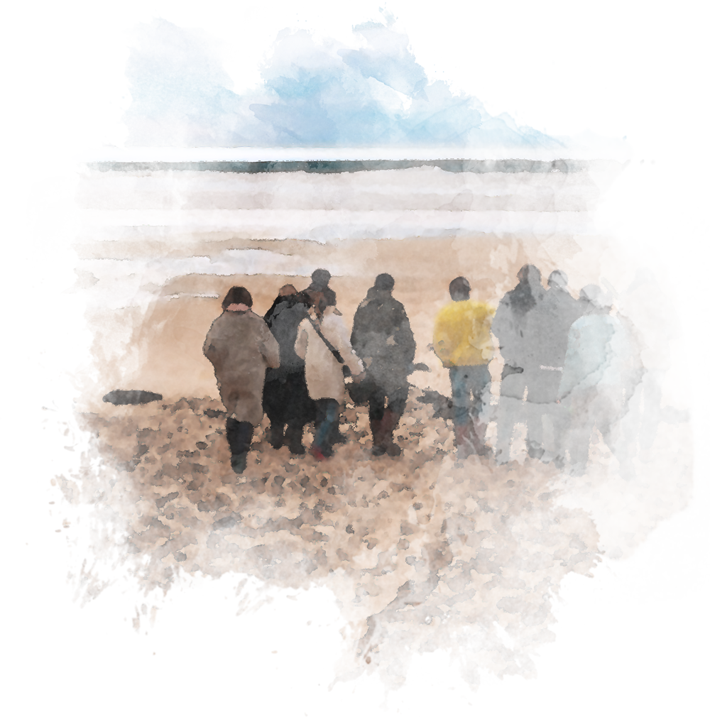 Schweiz. Verband der Bestattungsdienste Eine Gruppe von Menschen, die am Strand spazieren gehen.